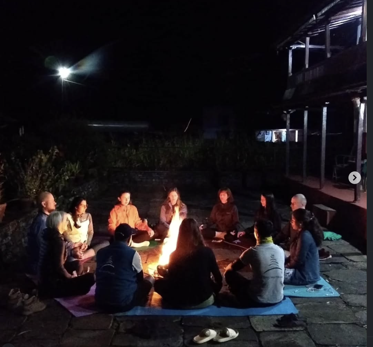 Fire ritual (Yagya) sacred ceremony with community gathered in circle