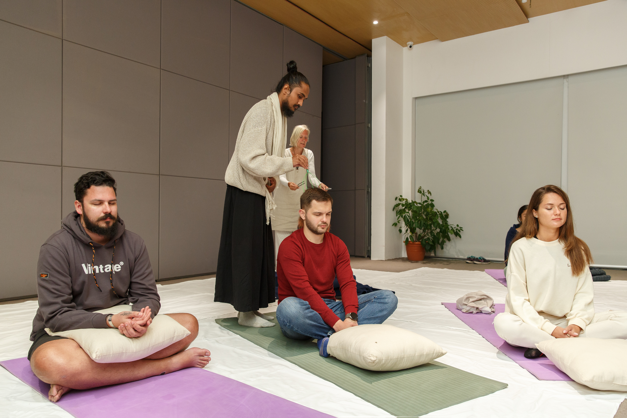 Group facilitation and guided meditation in indoor setting
