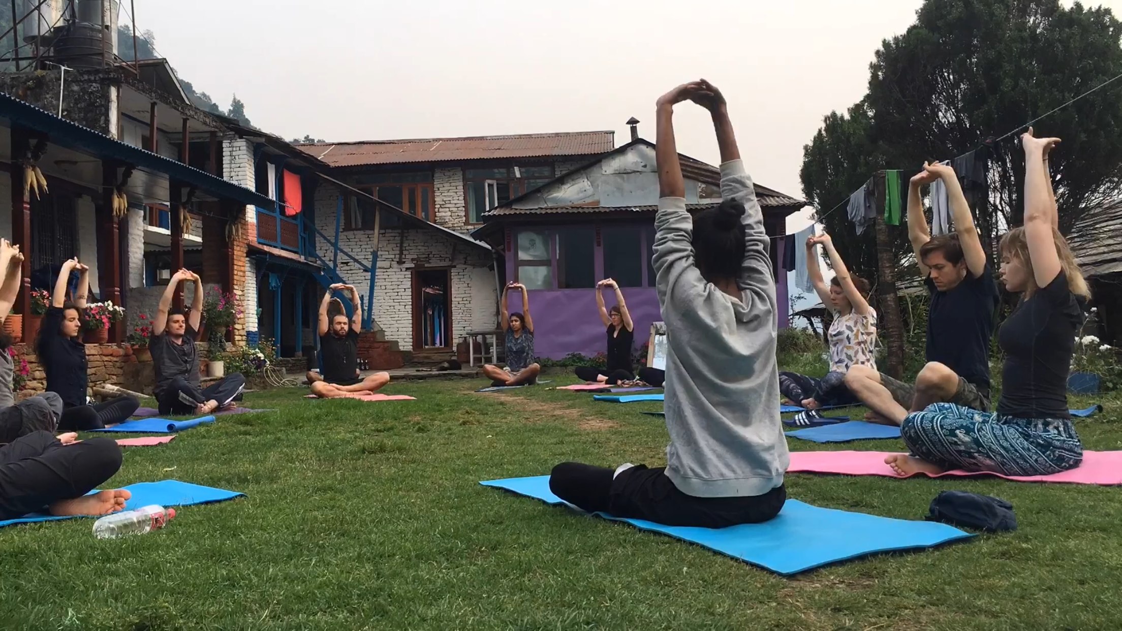 Group yoga class with dynamic movement at retreat center