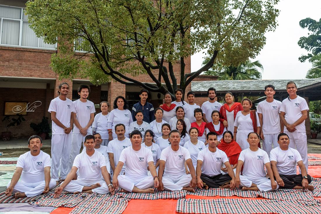 Large diverse group in white clothes outdoor celebration