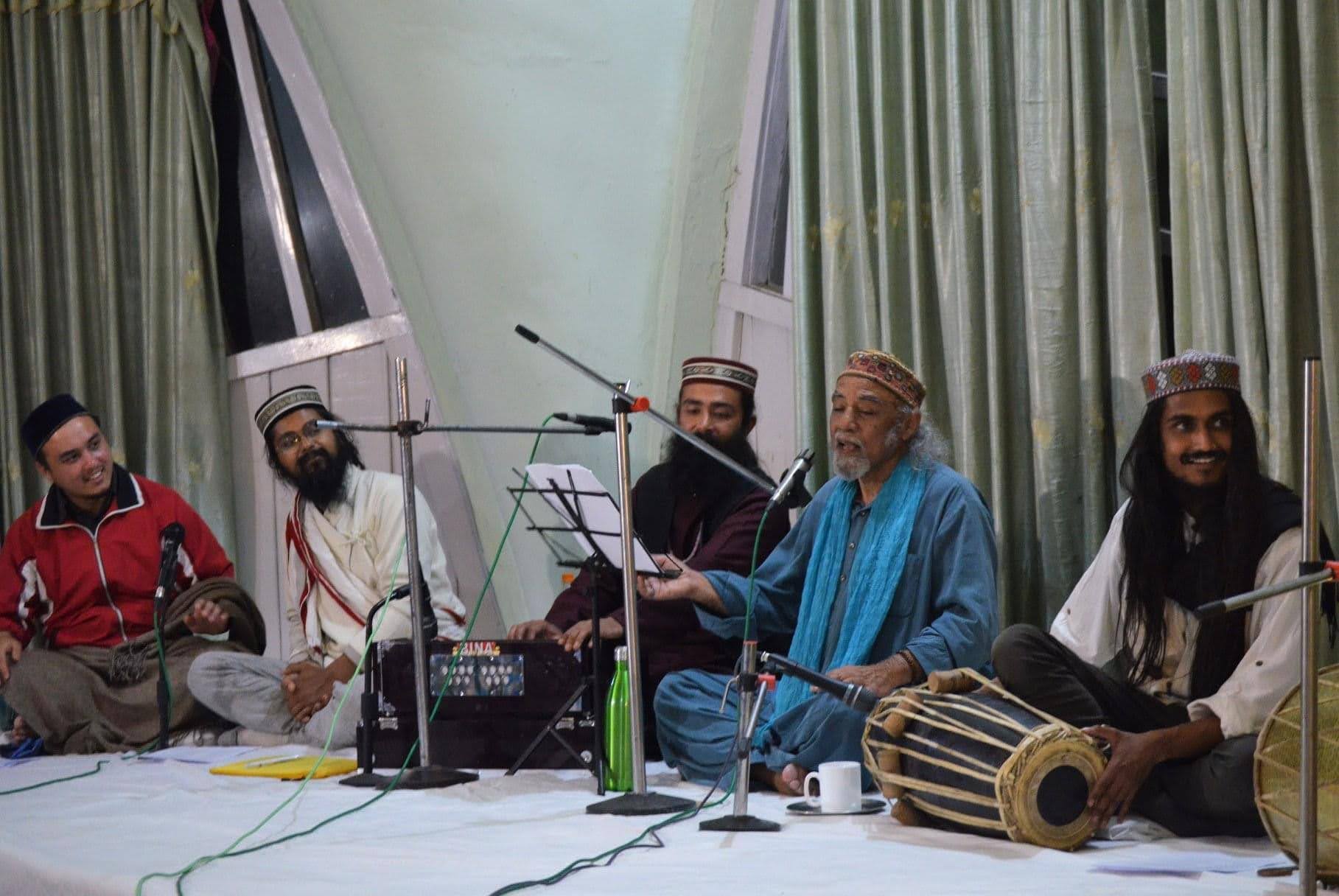 Musicians performing with traditional instruments in spiritual setting