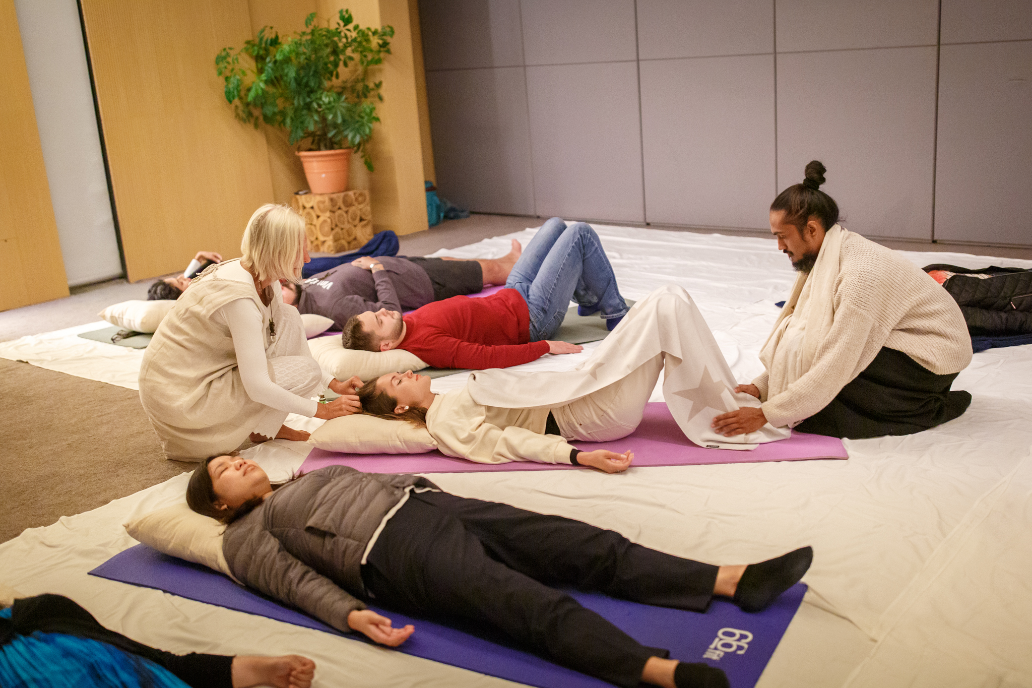 Intimate guided yoga relaxation session indoors